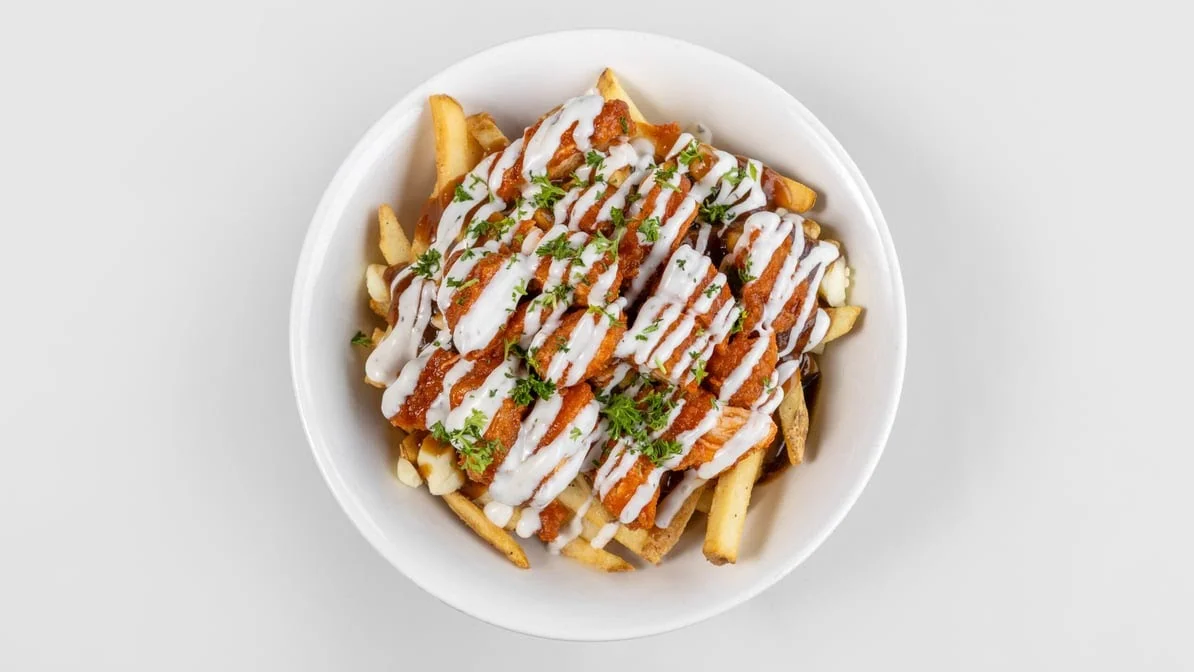 Buffalo chicken poutine with ranch drizzle at Calgary Pub & Restaurant in southeast Calgary, AB